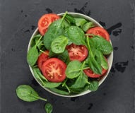 Spinach And Tomato Salad In A Bowl Royalty Free Stock Photo