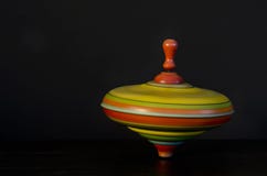 spinning-top-toy-antique-isolated-black-background-showing-motion-36179019.jpg