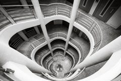 Spiral staircase climbing down, black and white