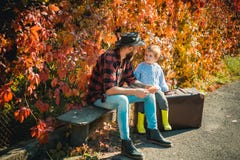 Spirit of adventurism. Family time. Adventure with son. Telling stories about past times. Father with suitcase and his royalty free stock photo Spirit of adventurism. Family time. Adventure with son. Telling stories about past times. Father with suitcase and his royalty free stock photo