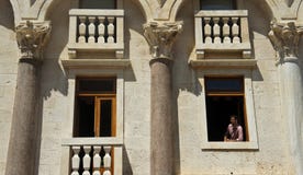 Split, Croatia - 07/22/2015 - Man inn the window of Diocletian Palace, sunny day, Dalmatia royalty free stock photos Split, Croatia - 07/22/2015 - Man inn the window of Diocletian Palace, sunny day, Dalmatia royalty free stock photos