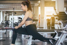 Sport asian woman stretching for warming up befor doing exercises cross fit body muscular training workout in gym royalty free stock photo Sport asian woman stretching for warming up befor doing exercises cross fit body muscular training workout in gym royalty free stock photo