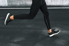 Sport. Close Up Of Male Legs Running On Road Outdoors. Stock Photo Sport. Close Up Of Male Legs Running On Road Outdoors. Stock Photo