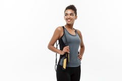 Sport, training, lifestyle and Fitness concept - portrait of beautiful happy African American woman exercising with stock images Sport, training, lifestyle and Fitness concept - portrait of beautiful happy African American woman exercising with stock images