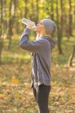 Sportswoman drinking water during jogging royalty free stock images Sportswoman drinking water during jogging royalty free stock images