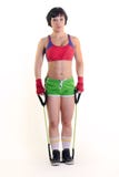 Sporty woman holding a exercise band in both hands royalty free stock photo Sporty woman holding a exercise band in both hands royalty free stock photo