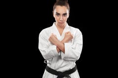 Sporty женщина карате и Тхэквондо в белом кимоно с черным поясом на темной предпосылке Концепция спорта с космосом экземпляра стоковые изображения Sporty женщина карате и Тхэквондо в белом кимоно с черным поясом на темной предпосылке Концепция спорта с космосом экземпляра стоковые изображения