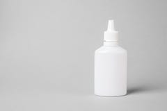 Spray For The Nose In A White Plastic Bottle On A Gray Background. Aerosol From The Common Cold Or Allergy Stock Photography
