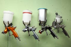 Spray guns are hanging on a hooks stock photography Spray guns are hanging on a hooks stock photography