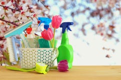 Spring cleaning concept with supplies on wooden table. Royalty Free Stock Photography Spring cleaning concept with supplies on wooden table. Royalty Free Stock Photography
