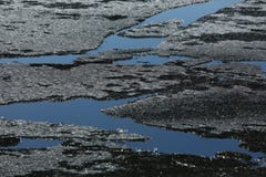 Spring lake with ice and open water stock photography Spring lake with ice and open water stock photography