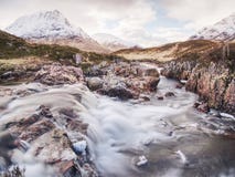 Spring river in Scottish highlands. Dramatic landscape of Glen Coe Royalty Free Stock Photo Spring river in Scottish highlands. Dramatic landscape of Glen Coe Royalty Free Stock Photo