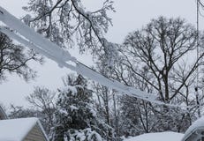 Spring snow covering electric wires attatched to house Royalty Free Stock Photography Spring snow covering electric wires attatched to house Royalty Free Stock Photography