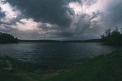 A spring thunderstorm over the river in the evening. stock image A spring thunderstorm over the river in the evening. stock image