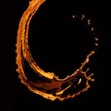 Spruzzata arancio dell'acqua isolata sul nero Immagini Stock Libere da Diritti Spruzzata arancio dell'acqua isolata sul nero Immagini Stock Libere da Diritti