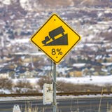 Square frame Close up of a yellow road grade sign with a truck on slope illustration stock photography Square frame Close up of a yellow road grade sign with a truck on slope illustration stock photography