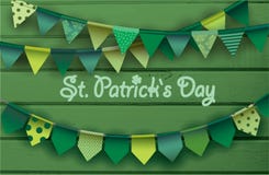 St. patrick`s day card. Colorful paper garlands on green wooden background. stock illustration St. patrick`s day card. Colorful paper garlands on green wooden background. stock illustration