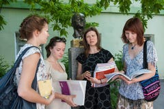 Lomonosov State University. A foreign language teacher talks with students during a break royalty free stock image Lomonosov State University. A foreign language teacher talks with students during a break royalty free stock image