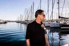 St. Tropez, France - 2019. Photographer working in the harbor of St. Tropez, French Riviera stock photo St. Tropez, France - 2019. Photographer working in the harbor of St. Tropez, French Riviera stock photo