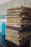 Stack of bath towels on wooden background closeup royalty free stock photo Stack of bath towels on wooden background closeup royalty free stock photo