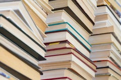 A stack of books with colorful covers. The library or bookstore. Books or textbooks. Education and reading stock photo A stack of books with colorful covers. The library or bookstore. Books or textbooks. Education and reading stock photo