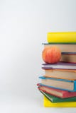 Stack of colorful real books, apple on white background, partial view. Back to school, Copy Space. Education . stock images Stack of colorful real books, apple on white background, partial view. Back to school, Copy Space. Education . stock images