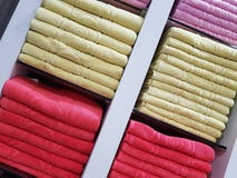 Stack of colorful towels on the shelfs Stock Images Stack of colorful towels on the shelfs Stock Images