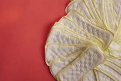 Stack of of feminine hygiene or menstrual pads on red background. Sanitary napkins for women royalty free stock photos Stack of of feminine hygiene or menstrual pads on red background. Sanitary napkins for women royalty free stock photos