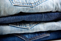 Stack Of Blue Jeans Stock Images