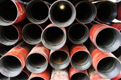 Stack of oil well intermediate casing bundles stock photo Stack of oil well intermediate casing bundles stock photo