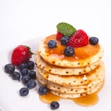 Stack of pancakes with fruits