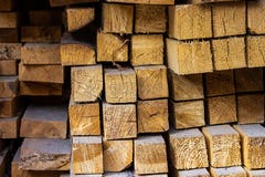 Stack square blocks timber building materials lumber end of the board close-up background light beige stock images Stack square blocks timber building materials lumber end of the board close-up background light beige stock images