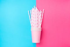 Stacked Drinking Paper Cups with Striped Straws on Duo Tone Mint Blue Pink Background. Flat Lay. Birthday Party Celebration Kids Royalty Free Stock Photo Stacked Drinking Paper Cups with Striped Straws on Duo Tone Mint Blue Pink Background. Flat Lay. Birthday Party Celebration Kids Royalty Free Stock Photo