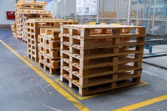 Stacked wooden pallets at a storage stock image Stacked wooden pallets at a storage stock image