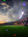 Stadionsolnedgångkonfettier och glitter med folkfans 3d framför illustrationen molnig arkivbild Stadionsolnedgångkonfettier och glitter med folkfans 3d framför illustrationen molnig arkivbild