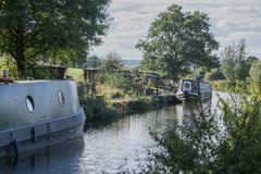 Staffordshire; British countryside on a sunny day; barges ona a canal. stock photo Staffordshire; British countryside on a sunny day; barges ona a canal. stock photo