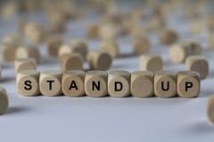 Stand up - cube with letters, sign with wooden cubes royalty free stock photography Stand up - cube with letters, sign with wooden cubes royalty free stock photography