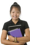 Standingwith asiático del estudiante sus libros fotografía de archivo libre de regalías Standingwith asiático del estudiante sus libros fotografía de archivo libre de regalías
