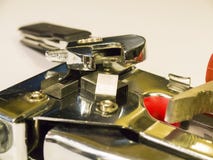 Stapler, pliers, wrench on a white background stock photo Stapler, pliers, wrench on a white background stock photo