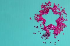 Star of pink stars on a blue background. Inside is empty for text. Flat lay, top view, copy space. Place for your text royalty free stock image Star of pink stars on a blue background. Inside is empty for text. Flat lay, top view, copy space. Place for your text royalty free stock image