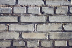 Starke Wand eines gewöhnlichen Hauses, errichtet von den Ziegelsteinen lizenzfreie stockbilder Starke Wand eines gewöhnlichen Hauses, errichtet von den Ziegelsteinen lizenzfreie stockbilder