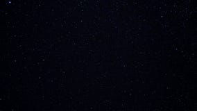 Starry night sky. Twinkling stars in the dark night sky. Starfall on a clear starry sky. Fascinating spectacle. Night