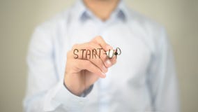 Start Up, Man Writing on Transparent Screen royalty free stock photography Start Up, Man Writing on Transparent Screen royalty free stock photography