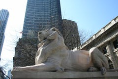 Statue Of A Lion In Cityscape Background Stock Photos