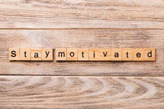 Stay motivated word written on wood block. Stay motivated text on wooden table for your desing, concept royalty free stock photo Stay motivated word written on wood block. Stay motivated text on wooden table for your desing, concept royalty free stock photo