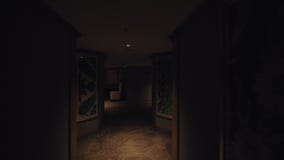 A steadicam shot of a dark hotel hallway