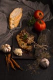 Steak,tomato,parsley, garlic,black pepper,bread,oregano stock photography Steak,tomato,parsley, garlic,black pepper,bread,oregano stock photography