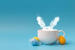 Steam In Rabbit Ears Shape From Coffee Cup Decorated Easter Colored Eggs. Morning Drink. Easter Celebration Concept. Copy Space Royalty Free Stock Photo