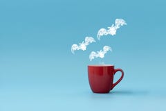 Steam In Three Bats Shape Flying From Coffee Cup Against Blue Background. Morning Drink. Halloween Celebration Concept. Copy Royalty Free Stock Photography Steam In Three Bats Shape Flying From Coffee Cup Against Blue Background. Morning Drink. Halloween Celebration Concept. Copy Royalty Free Stock Photography