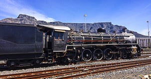 Steam Train with Table Mountain in background stock photo Steam Train with Table Mountain in background stock photo